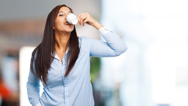 Free Photo | Woman drinking from a white mug