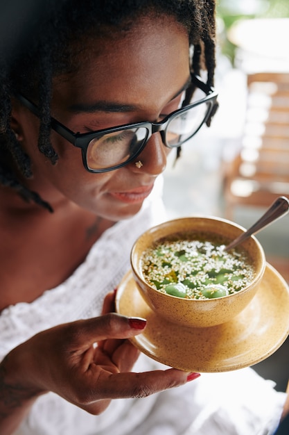 Premium Photo | Woman eating exotic food