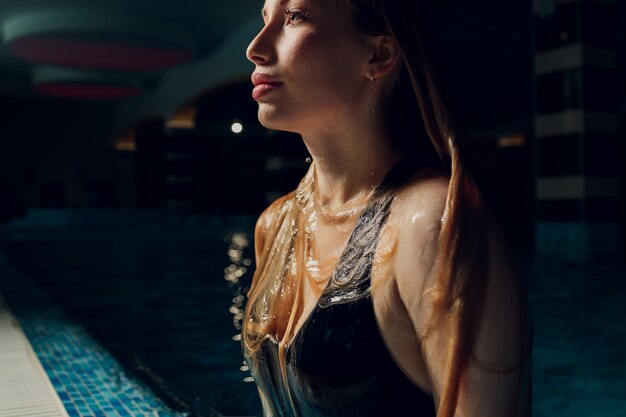 Premium Photo Woman Emerging From Swimming Underwater At The Pool