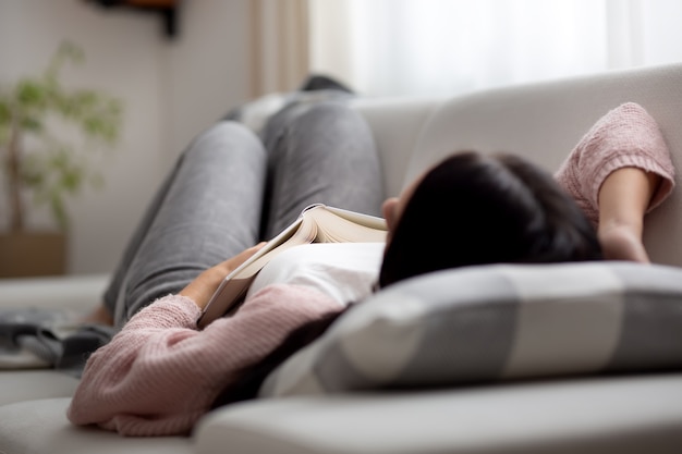 premium-photo-a-woman-falling-asleep-during-the-day-on-a-couch-while