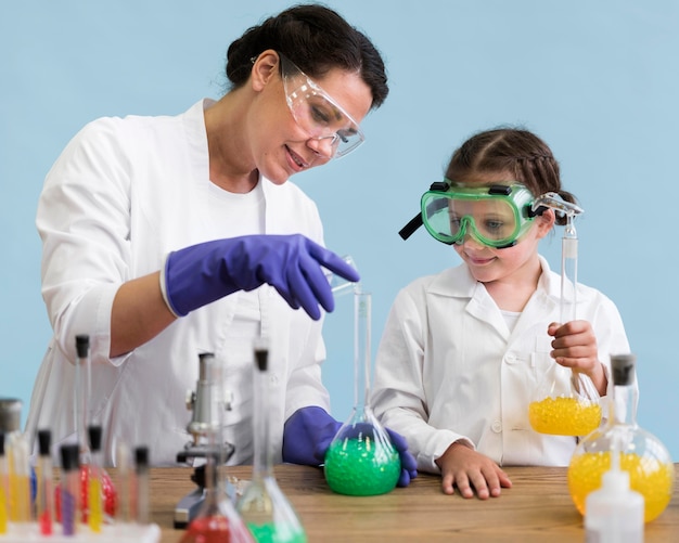 Free Photo | Woman and girl doing science