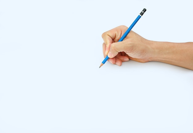 Woman hand holding a pencil on a white paper background ...