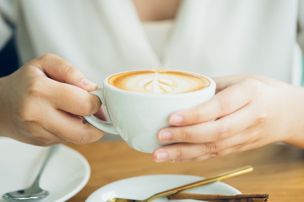 Premium Photo Woman Hand Holding A White Coffee Mug