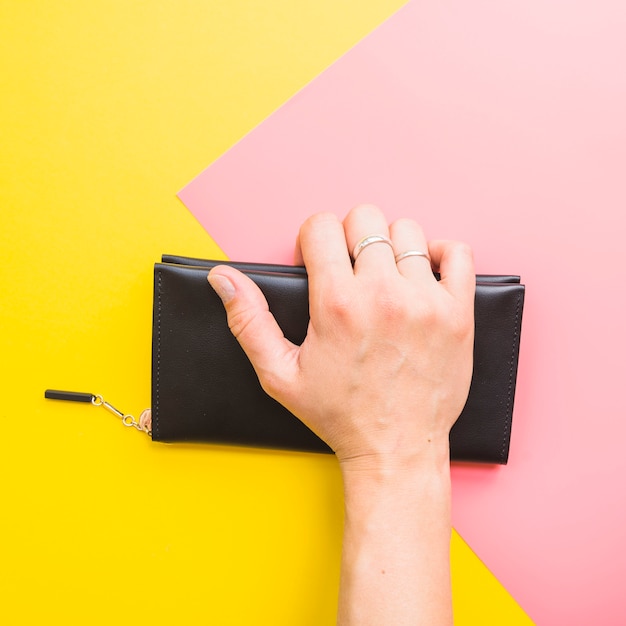 Woman hand with clutch bag | Free Photo