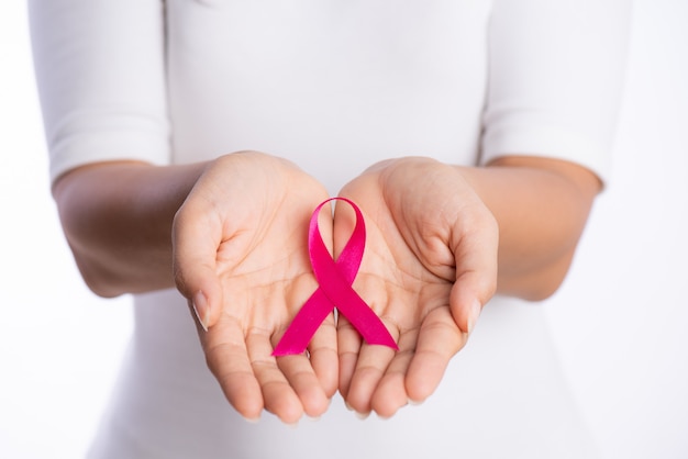 Premium Photo Woman Hands Holding Pink Breast Cancer Awareness Ribbon