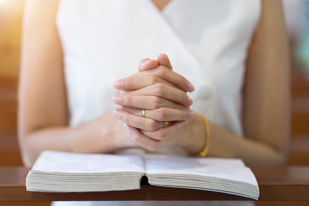 Premium Photo Woman Hands Praying On A Holy Bible In Church For Faith