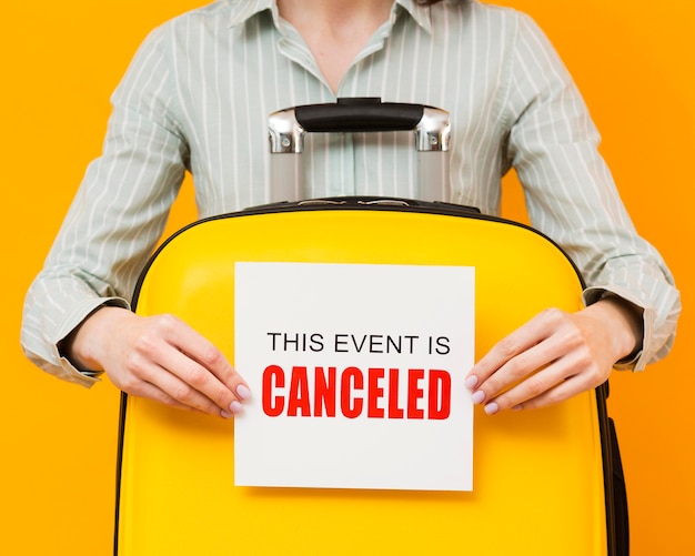 free-photo-woman-holding-a-cancelled-event-card