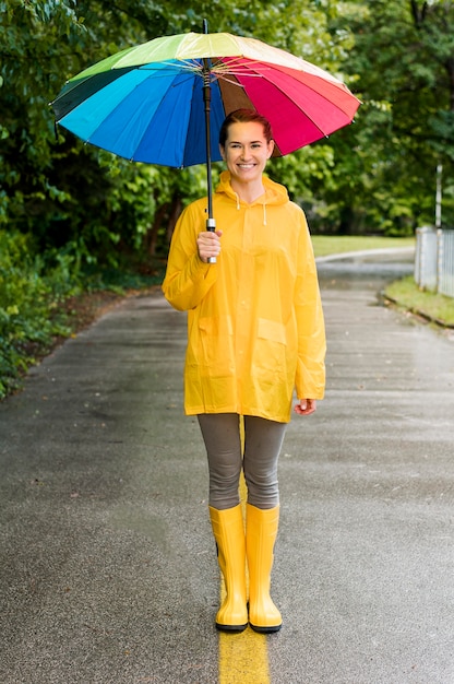 Free Photo | Woman holding a colorful umbrella