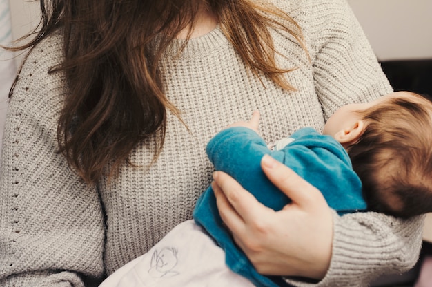 Free Photo | Woman holding cute baby in arms