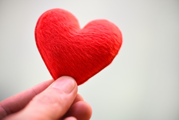 Premium Photo Woman Holding Pink Heart In Hands For Valentines Day Or Donate Help Give Love Warmth Take Care Heart On Hand For Philanthropy Concept