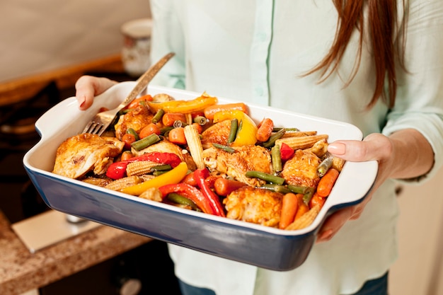 Free Photo | Woman Holding Tray Of Food For Dinner