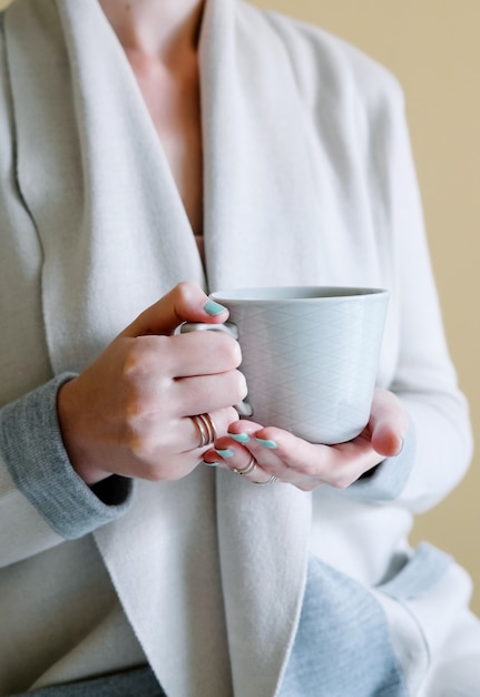 Premium Photo | Woman is holding hot tea