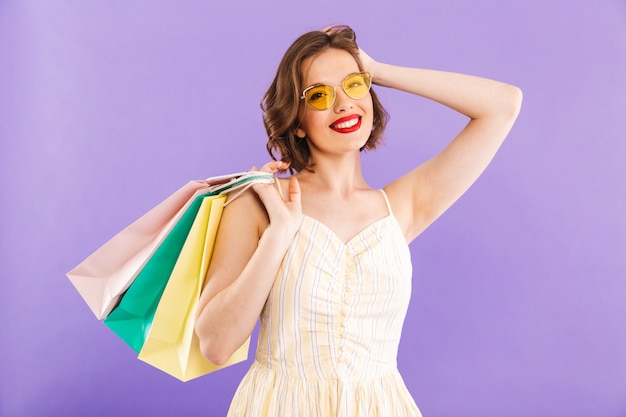 Premium Photo | Woman isolated holding shopping bags.