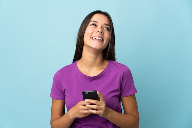 Premium Photo Woman Isolated On Pink Using Mobile Phone And Looking Up 