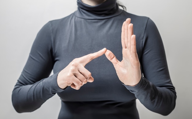 Premium Photo | Woman learns sign language to talk