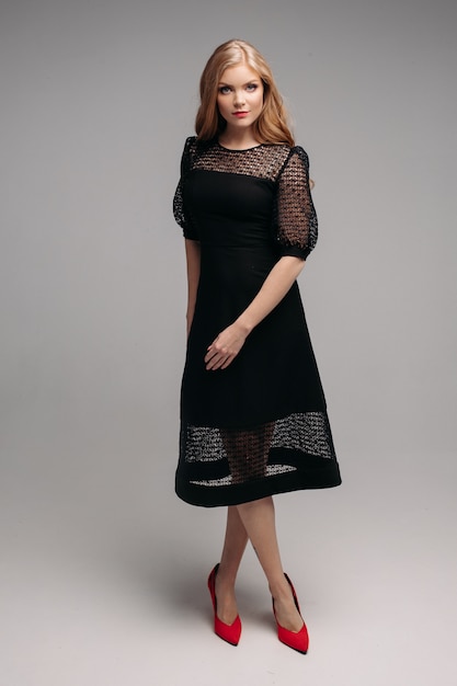 Woman in long black dress posing Premium Photo