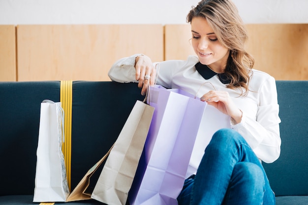 Free Photo | Woman looking at purchases