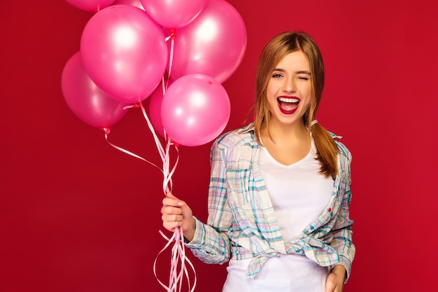 Free Photo | Woman model with pink air balloons. winking