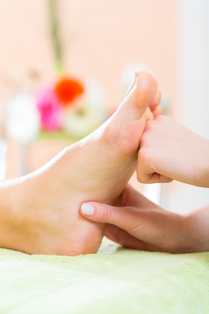 Premium Photo Woman In Nail Salon Receiving Foot Massage