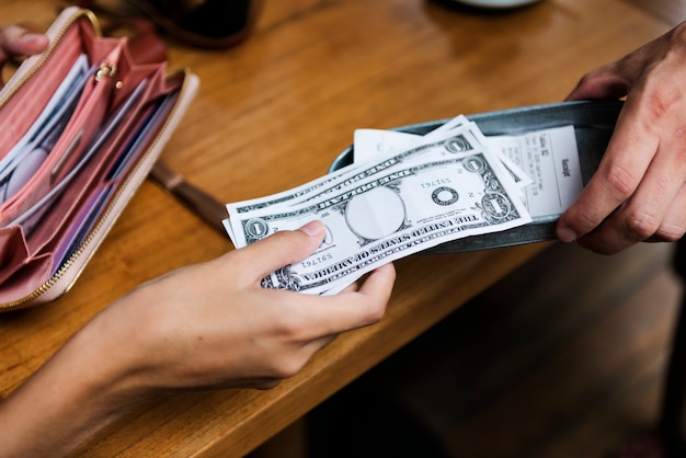 Free Photo | Woman paying cash for bill restaurant