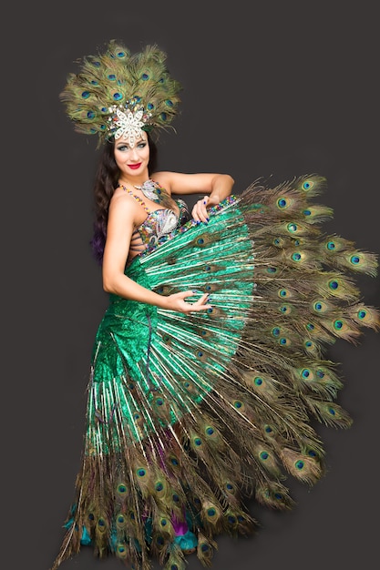 Premium Photo Woman In Peacock Feather Carnival Costume Dancing In Show