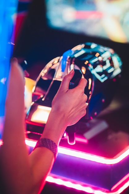 Free Photo | Woman playing arcade game