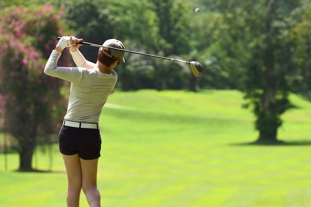 Premium Photo Woman Playing Golf On A Beautiful Natural Golf Course