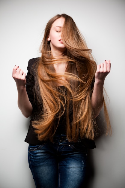 Woman posing with long flowing hair | Premium Photo