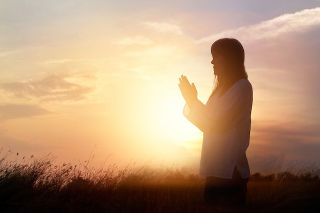 Premium Photo | Woman praying and practicing meditating on nature ...