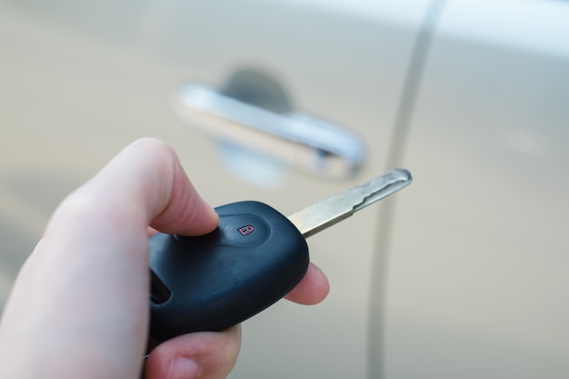 Woman Presses Remote Control Car Key Door Lock System