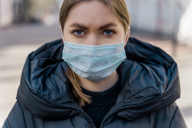 Premium Photo | Woman put on face mask to protects from virus covid-19