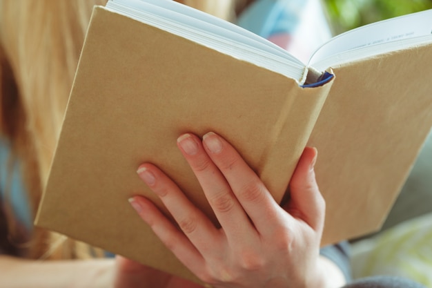 Premium Photo | Woman reading book in room