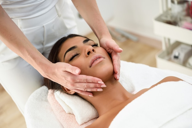 Woman Receiving Head Massage In Spa Wellness Center Premium Photo
