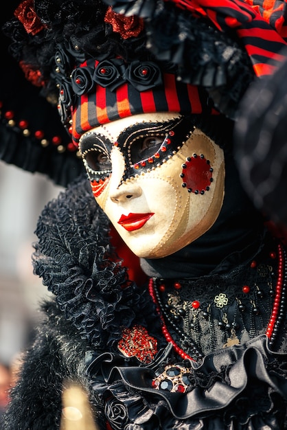 Premium Photo | Woman in red venetian carnival costume