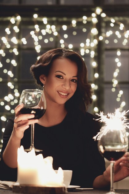 Woman In Restaurant Holding A Wine Glass Free Photo