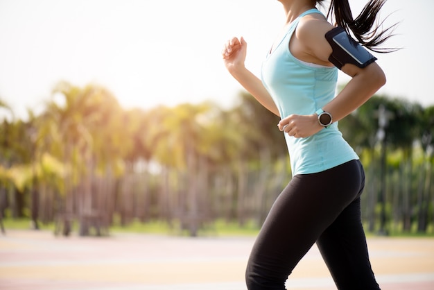 Premium Photo | Woman running towards on the road side. step, run and ...