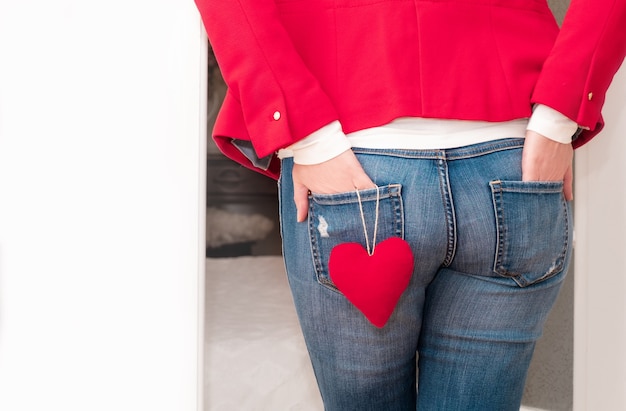jeans with 3 red lines on back pocket