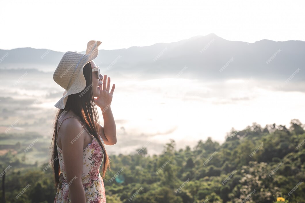 Free Photo | A woman shouting in the mountains