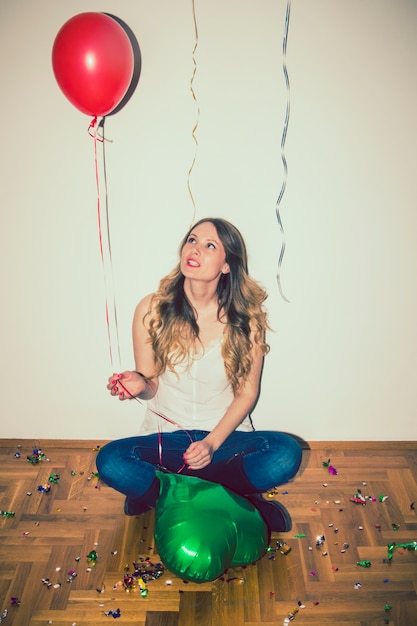 Free Photo | Woman sitting on the floor during the party