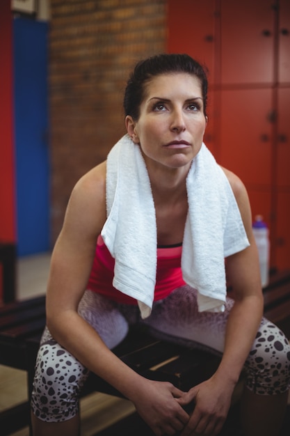 Premium Photo Woman Sitting In Gym Locker Room After Workout