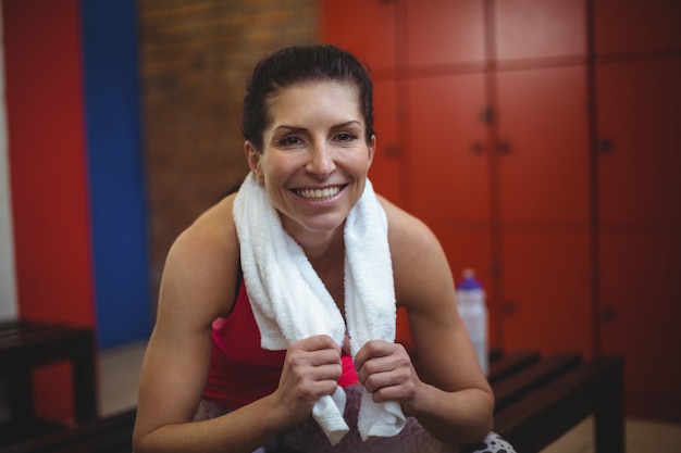 Woman Sitting In Gym Locker Room After Workout Premium Photo