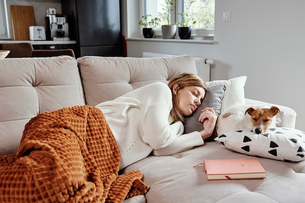 Premium Photo | Woman sleep with dog on sofa