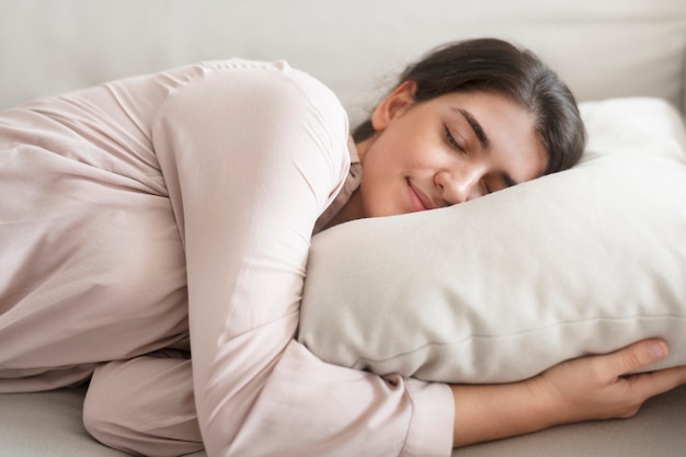 Woman sleeping comfortably on her pillow Free Photo