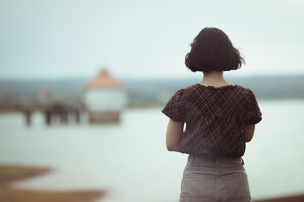 Woman standing thinking to something with lonely . Premium Photo