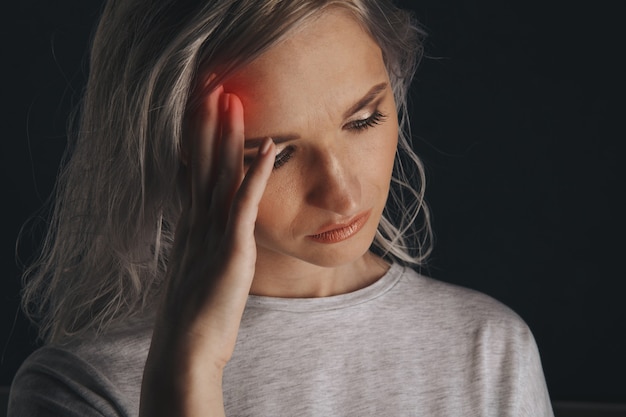 Premium Photo | Woman in stress with pain on her face feeling headache.