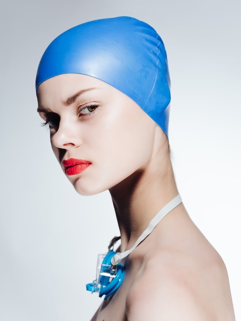 Premium Photo | Woman in swimming cap red lips posing professionals