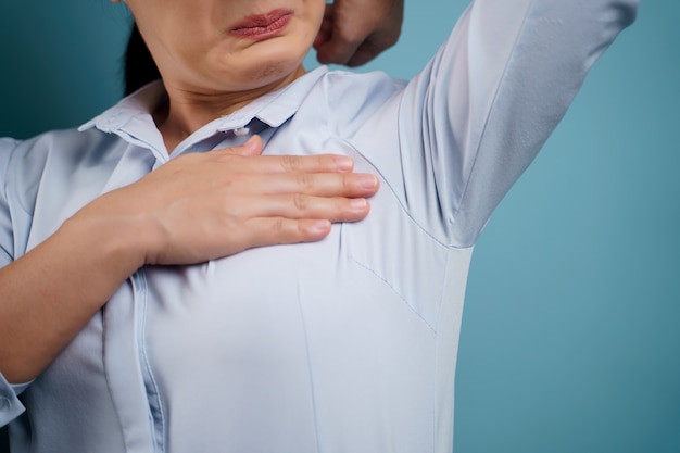 Premium Photo | Woman testing smelling her armpit