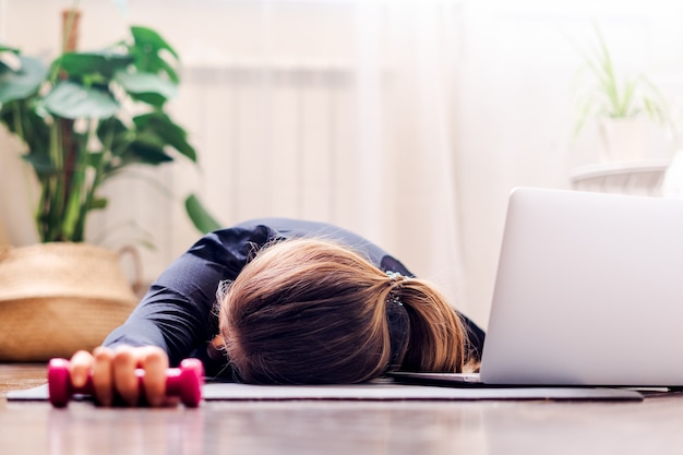 Premium Photo | Woman tired after exercise and workout.