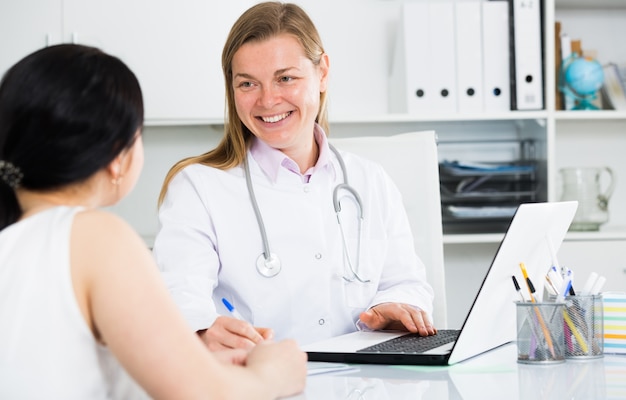 Woman visiting female doctor Free Photo