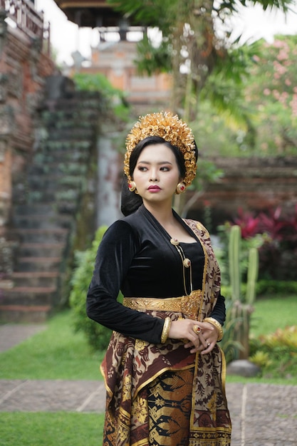 Premium Photo | Woman Wearing Balinese Kebaya Standing In The Yard